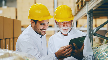 two contractors on job site conveniently access certificates on ipad